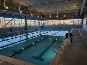 Commercial indoor competition lap pool with mountain views in Albuquerque.
